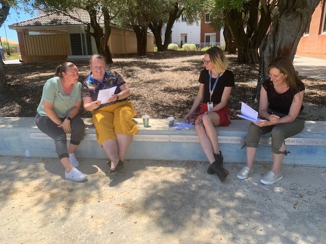 Staff collaborating outside 