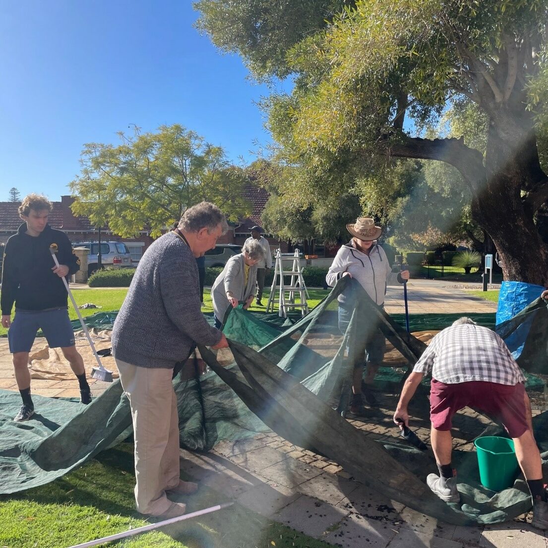 MercyCare volunteers laying the mats for the harvest