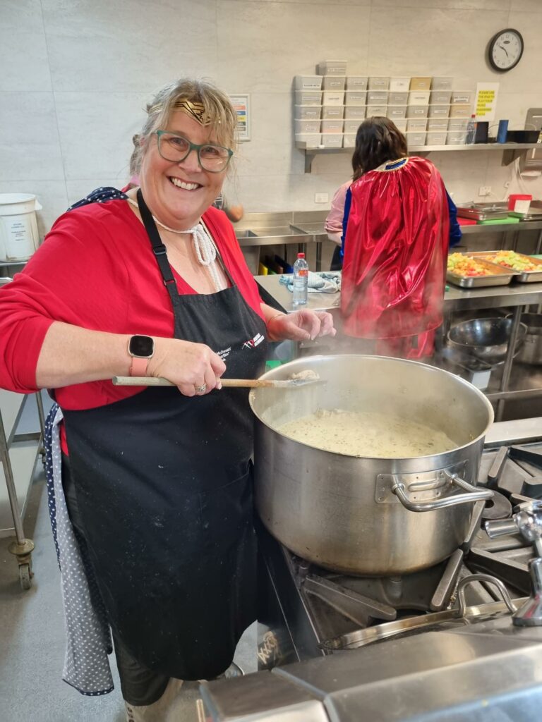 Early Learning Volunteers cooking 